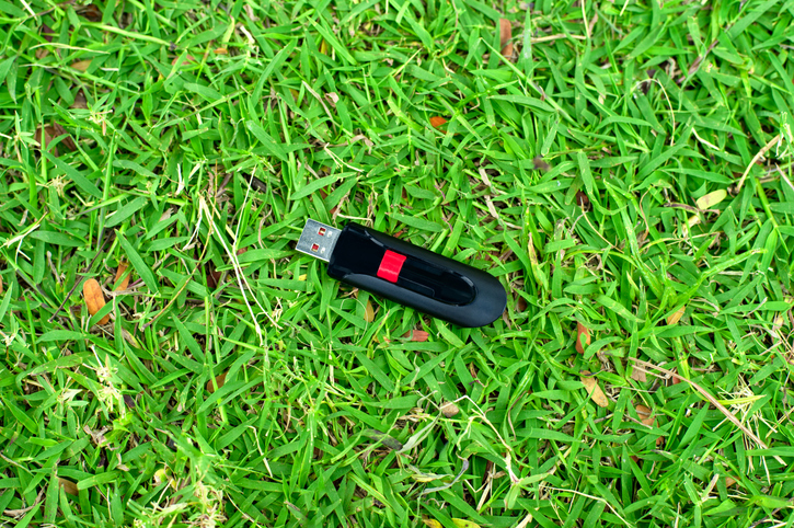 usb flash drive on grass background